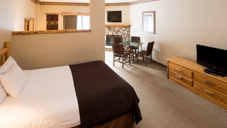 The beds in the Lone Wolf Fireplace Suite
